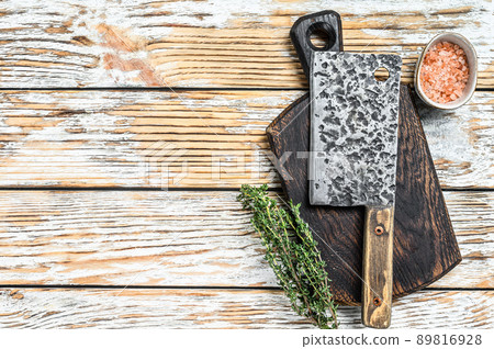 Old meat butcher cleaver. White wooden background. Top view. Copy space Old meat butcher cleaver. White wooden background. Top view. Copy space 89816928