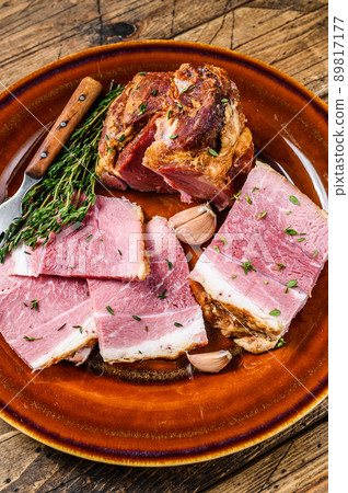 Smoked pork Slab Bacon meat slices on a rustic plate. wooden background. Top view Smoked pork Slab Bacon meat slices on a rustic plate. wooden background. Top view 89817177