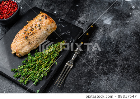Whole barbecue baked pork tenderloin. Black background. Top view. Copy space Whole barbecue baked pork tenderloin. Black background. Top view. Copy space 89817547
