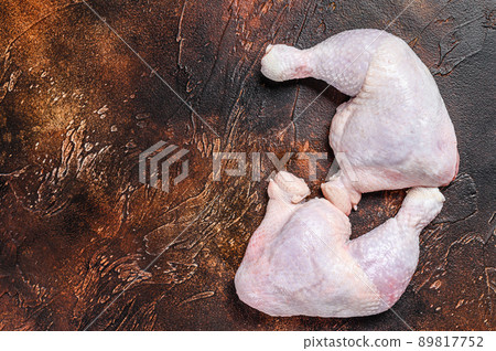 Fresh raw chicken leg. White background. Top view. Copy space Fresh raw chicken leg. White background. Top view. Copy space 89817752