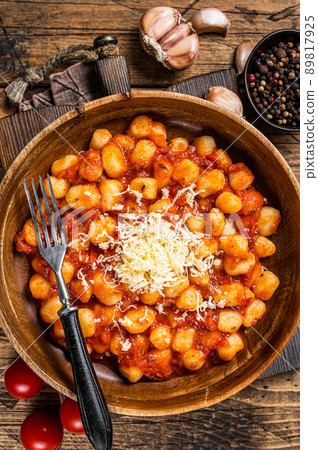 Italian Gnocchi potato pasta in tomato sauce. Wooden background. Top view 89817925