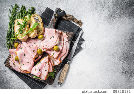 Toast with pork Ham and olives. White background. Top view. Copy space Toast with pork Ham and olives. White background. Top view. Copy space 89818181