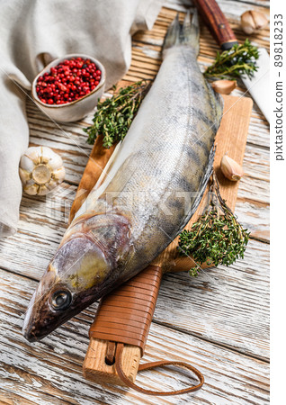 Fresh Zander, walleye with herbs. Raw fish. White background. Top view. Copy space 89818233