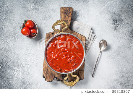 Classic Italian tomato sauce with basil for pasta and pizza in skillet. White background. Top view Classic Italian tomato sauce with basil for pasta and pizza in skillet. White background. Top view 89818807