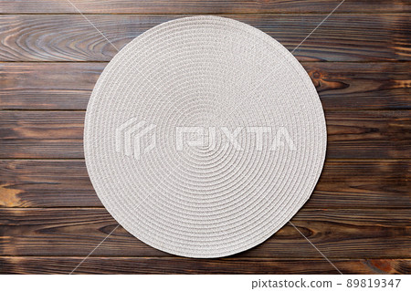 Topview of round tablecloth for food on wooden background. Empty space for your design 89819347