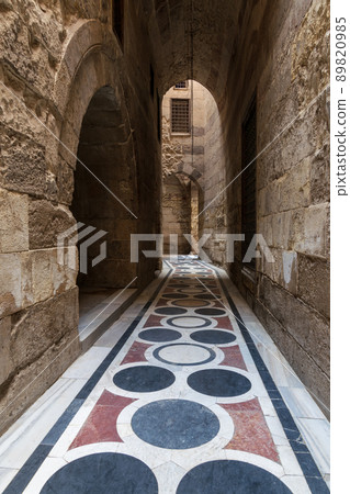 Vaulted passage leading to the Courtyard of Sultan Qalawun mosque with colorful marble floor, Cairo 89820985