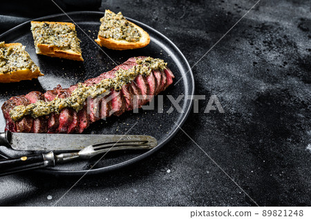 Grilled denver marble black angus beef steak. Black background. Top view. Copy space 89821248
