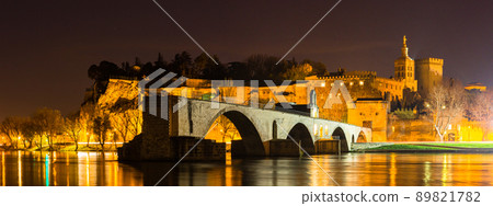 Pont d'Avignon in Avignon at night illuminated in France and Notre Dame de Don Cathedral in the old town Pont d'Avignon in Avignon at night illuminated in France and Notre Dame de Don Cathedral in the old town 89821782