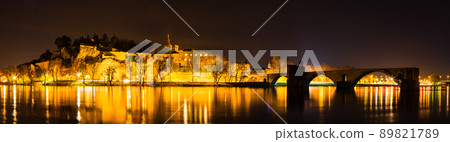 Pont d'Avignon in Avignon at night illuminated in France and Notre Dame de Don Cathedral in the old town 89821789