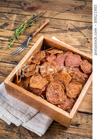 Meat Jerky from beef and pork meat. wooden background. Top view Meat Jerky from beef and pork meat. wooden background. Top view 89821985