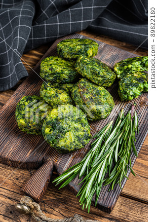 Roasted vegetarian broccoli and pea vegetable patty or cutlet, falafel. wooden background. Top view 89822180