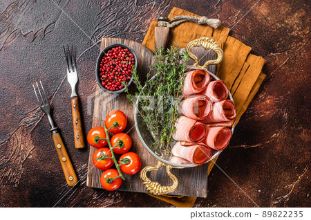 German Black Forest Ham Slices in skillet with thyme. Dark background. Top view 89822235