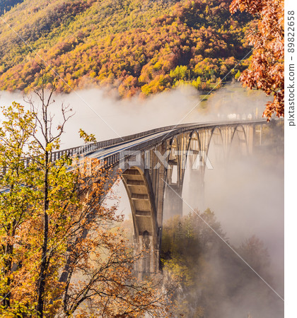 Montenegro. Dzhurdzhevich Bridge Over The River Tara foggy morning 89822658