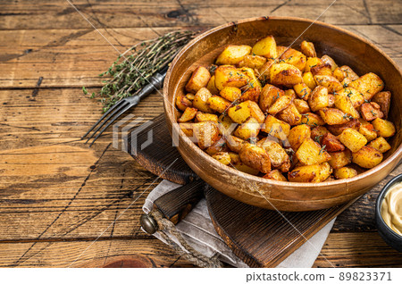 Fried potato - Patatas bravas traditional Spanish potatoes snack tapas. wooden background. Top view. Copy space 89823371