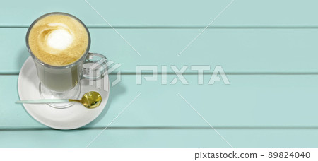 Latte in a beautiful cup on a table Latte in a beautiful cup on a table 89824040