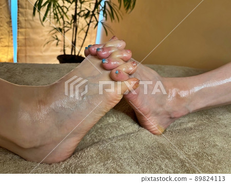 Two beautifully nailed women's toes and insteps Two beautifully nailed women's toes and insteps 89824113