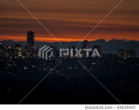 City lights after sunset on darker sky background City lights after sunset on darker sky background 89826405