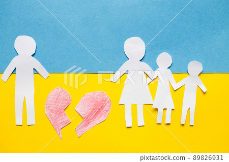paper cut divided family on the background of the ukrainian flag. stop war concept 89826931