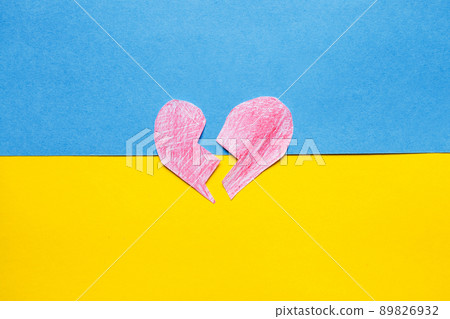 broken red heart on the ukrainian flag background 89826932