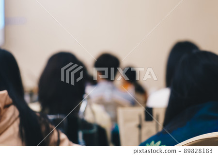 Blurred group of people seminar meeting in hotel ballroom Blurred group of people seminar meeting in hotel ballroom 89828183