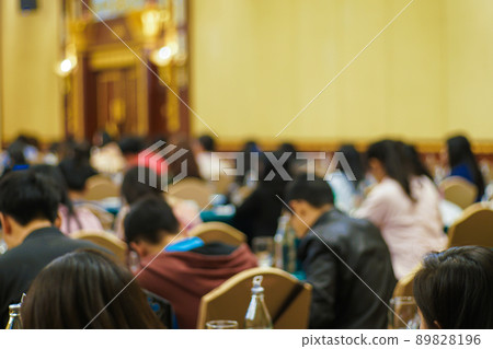 Blurred group of people seminar meeting in hotel ballroom Blurred group of people seminar meeting in hotel ballroom 89828196