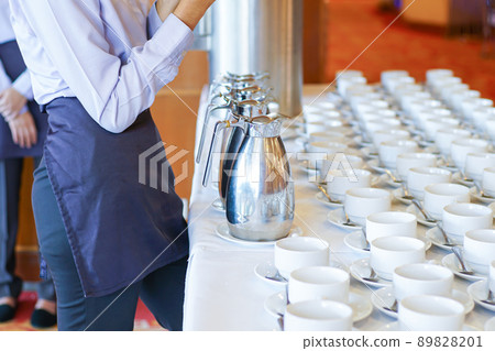 Hot coffee cup row with spoon in hotel Hot coffee cup row with spoon in hotel 89828201
