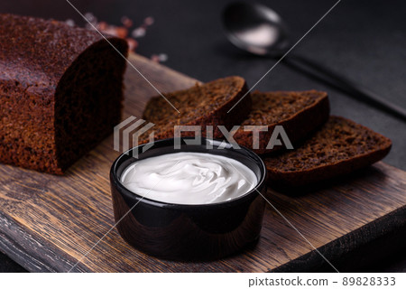Sliced rye bread on cutting board. Whole grain rye bread with seeds Sliced rye bread on cutting board. Whole grain rye bread with seeds 89828333