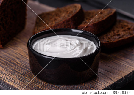 Sliced rye bread on cutting board. Whole grain rye bread with seeds Sliced rye bread on cutting board. Whole grain rye bread with seeds 89828334