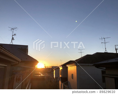 First sunrise seen from a residential area 89829610