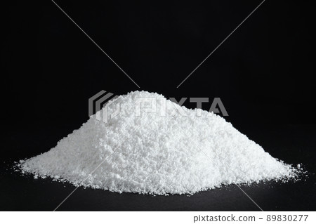 Heap of white snow on black background 89830277
