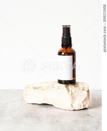 Mock-up of amber-colored glass bottle to natural stone. Mock-up of amber-colored glass bottle to natural stone. 89831006