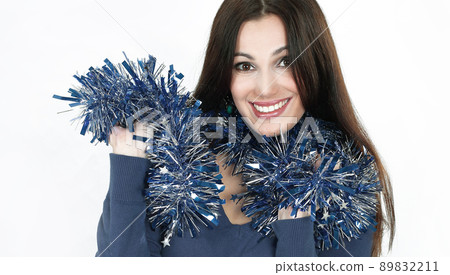 closeup.pretty girl with Christmas tinsel .isolated on white 89832211