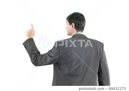The young businessman it is worth his back, finger raised up. The young businessman it is worth his back, finger raised up. 89832273
