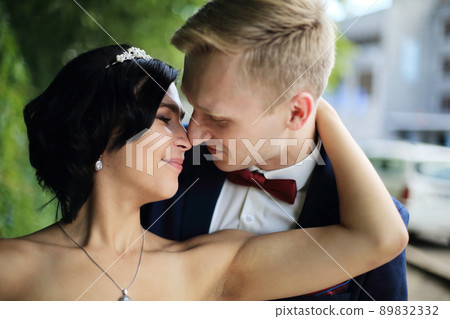 closeup. portrait of tender couple on the wedding day. closeup. portrait of tender couple on the wedding day. 89832332