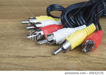 Group of the patchcords with connector rests upon wooden table Group of the patchcords with connector rests upon wooden table 89832576