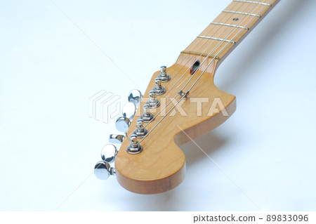 The neck of the guitar on white background The neck of the guitar on white background 89833096