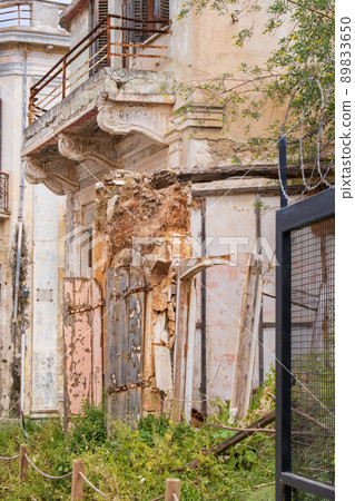 Abandoned buildings and wild vegetation in the Ghost Resort City of Varosha Famagusta, Cyprus Abandoned buildings and wild vegetation in the Ghost Resort City of Varosha Famagusta, Cyprus 89833650
