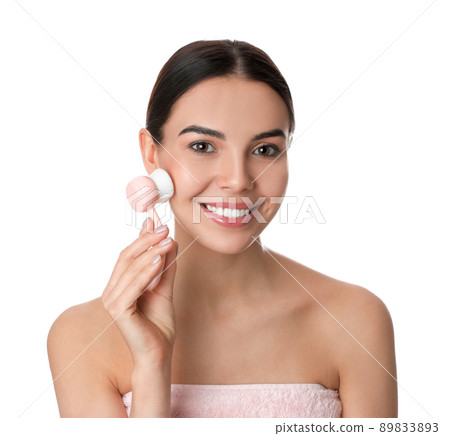 Young woman using facial cleansing brush on white background. Washing accessory 89833893