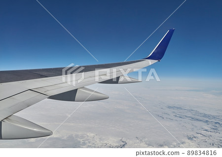 Flying on a plane 89834816