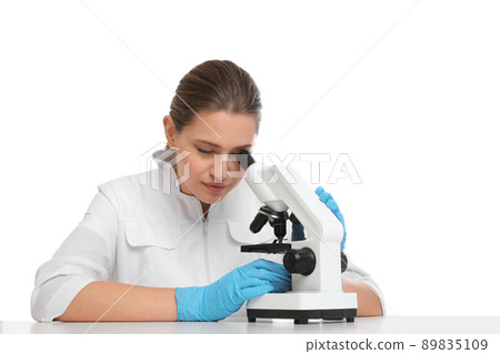 Scientist using modern microscope at table isolated on white. Medical research Scientist using modern microscope at table isolated on white. Medical research 89835109
