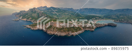 Aerial view of the luxury cliff house hotel on top of the cliff on the island of Mallorca. Aerial view of the luxury cliff house hotel on top of the cliff on the island of Mallorca. 89835975