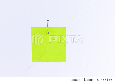 Mockup of a Blank Green Memo Paper with Copy Space Hanging on a Fishing Hook 89836156