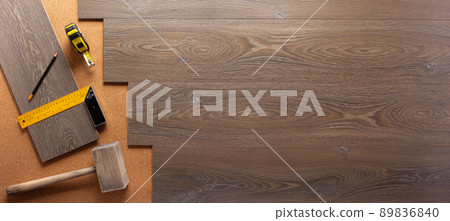 Wood laminate and tools on floor background texture. Wooden laminate top view Wood laminate and tools on floor background texture. Wooden laminate top view 89836840
