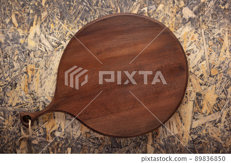 Cutting board on wood background top table. Wooden pizza board Cutting board on wood background top table. Wooden pizza board 89836850