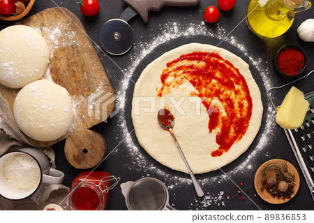 Pizza and sauce homemade cooking with ingredients on table. Dough pizza at tabletop 89836853