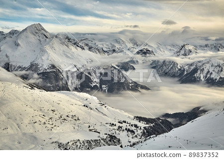 Mountain winter landscape above clouds Mountain winter landscape above clouds 89837352