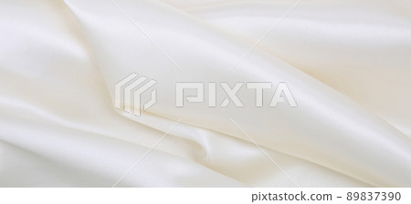 Smooth elegant white silk or satin luxury cloth texture as wedding background. Luxurious background design Smooth elegant white silk or satin luxury cloth texture as wedding background. Luxurious background design 89837390