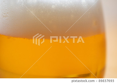 Zoom-up photo of beer poured into a glass Zoom-up photo of beer poured into a glass 89837693