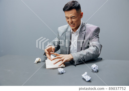 worker sits in the office emotions nervous breakdown anger Lifestyle 89837752