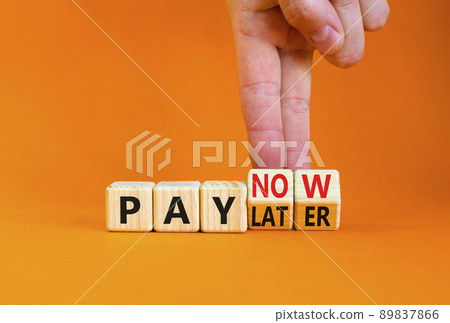 Pay later or now symbol. Businessman turns wooden cubes and changes concept words Pay later to Pay now. Beautiful orange table orange background. Business pay later or now concept. Copy space. Pay later or now symbol. Businessman turns wooden cubes and changes concept words Pay later to Pay now. Beautiful orange table orange background. Business pay later or now concept. Copy space. 89837866